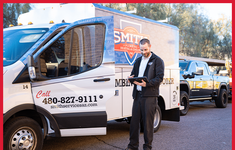 Smith Plumbing, Heating And Cooling Plumber Standing Next To Truck